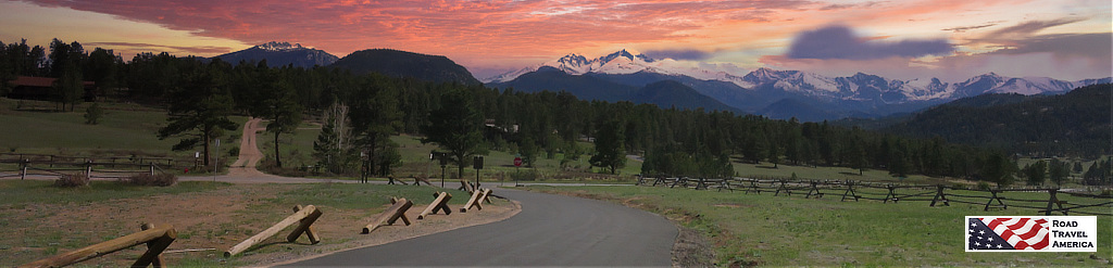 Quiet green meadows against fiery skies at Rocky Mountain National Park