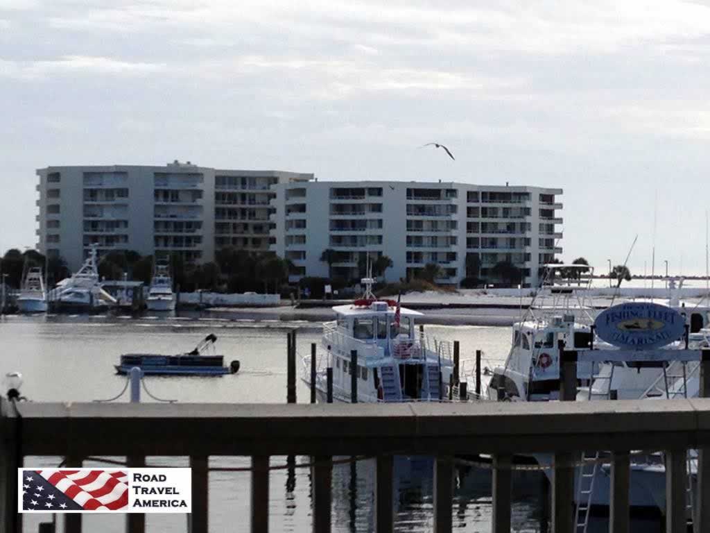 The Destin harbor with a part of the fishing fleet docked, with East Pass Towers in the distance The Destin harbor with a part of the fishing fleet docked, with East Pass Towers in the distance