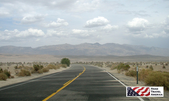 Dust storm winds send sand blowing across the road in Death Valley National Park