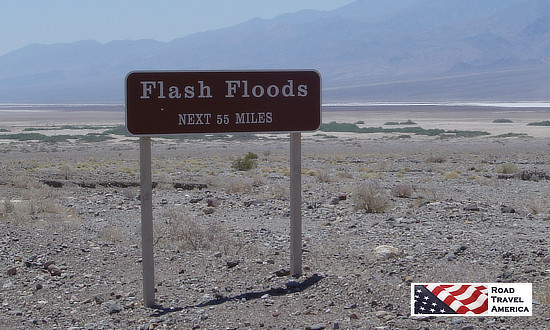 Sign warning of flash floods in Death Valley National Park, next 55 miles
