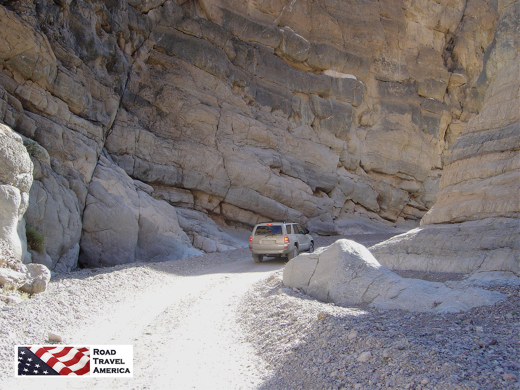The narrow passage between towering rocks in Titus Canyon Road in Death Valley National Park