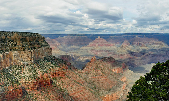 Grand Canyon National Park is located in Arizona, and is centered on a Colorado River canyon that is 277 river miles long, up to 18 miles wide, and a mile deep. 