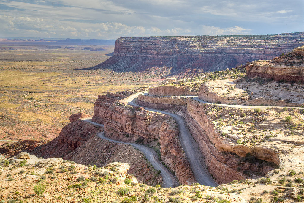 Aerial view of the Moki Dugway in Utah, seen from the top of Cedar Mesa, with the Valley of the Gods below