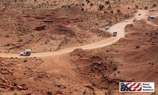 Tour trucks driving the 17-mile dirt road at Monument Valley Tribal Park