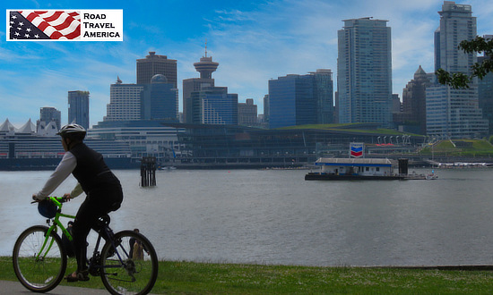 Bike riding in Vancouver, British Columbia, with the downtown skyline in the distance